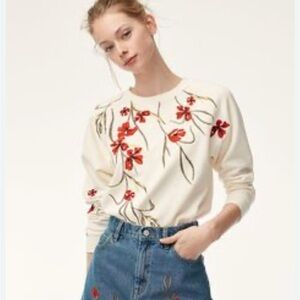 aritzia Little Moon Cream Top with Red Floral Design